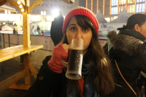 Susan drinking hot wine at a Christmas market.